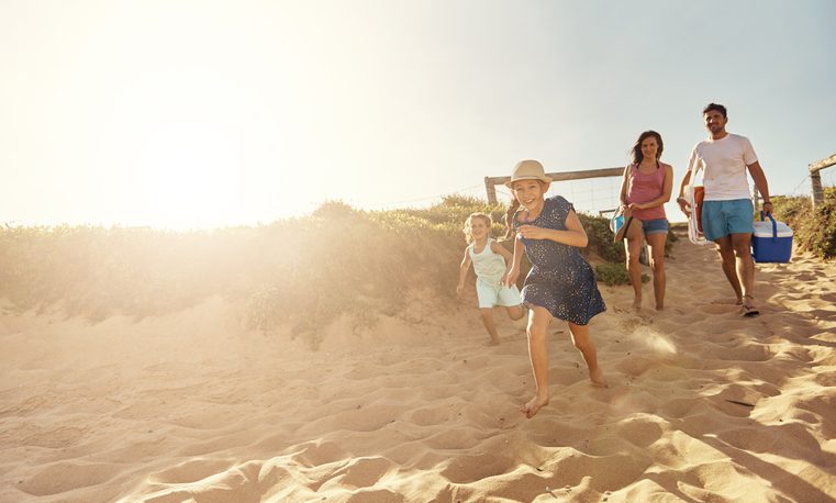 Shot of a young family arriving at myrtle beach